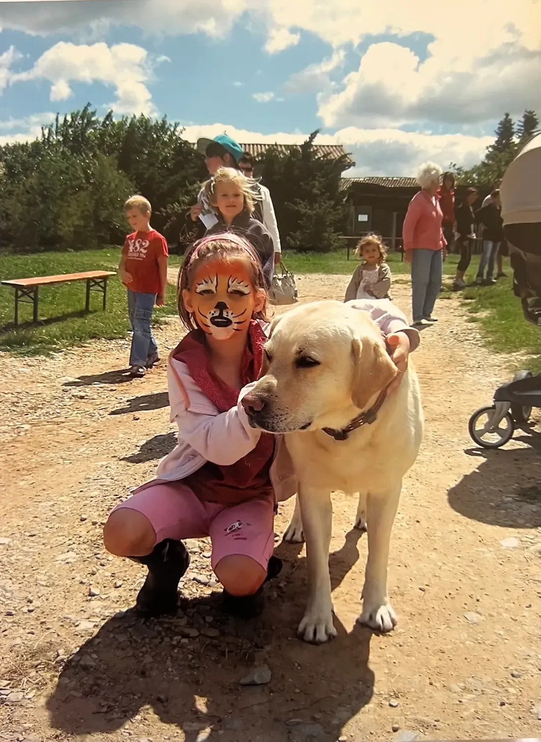 Emily as a little girl with a dog